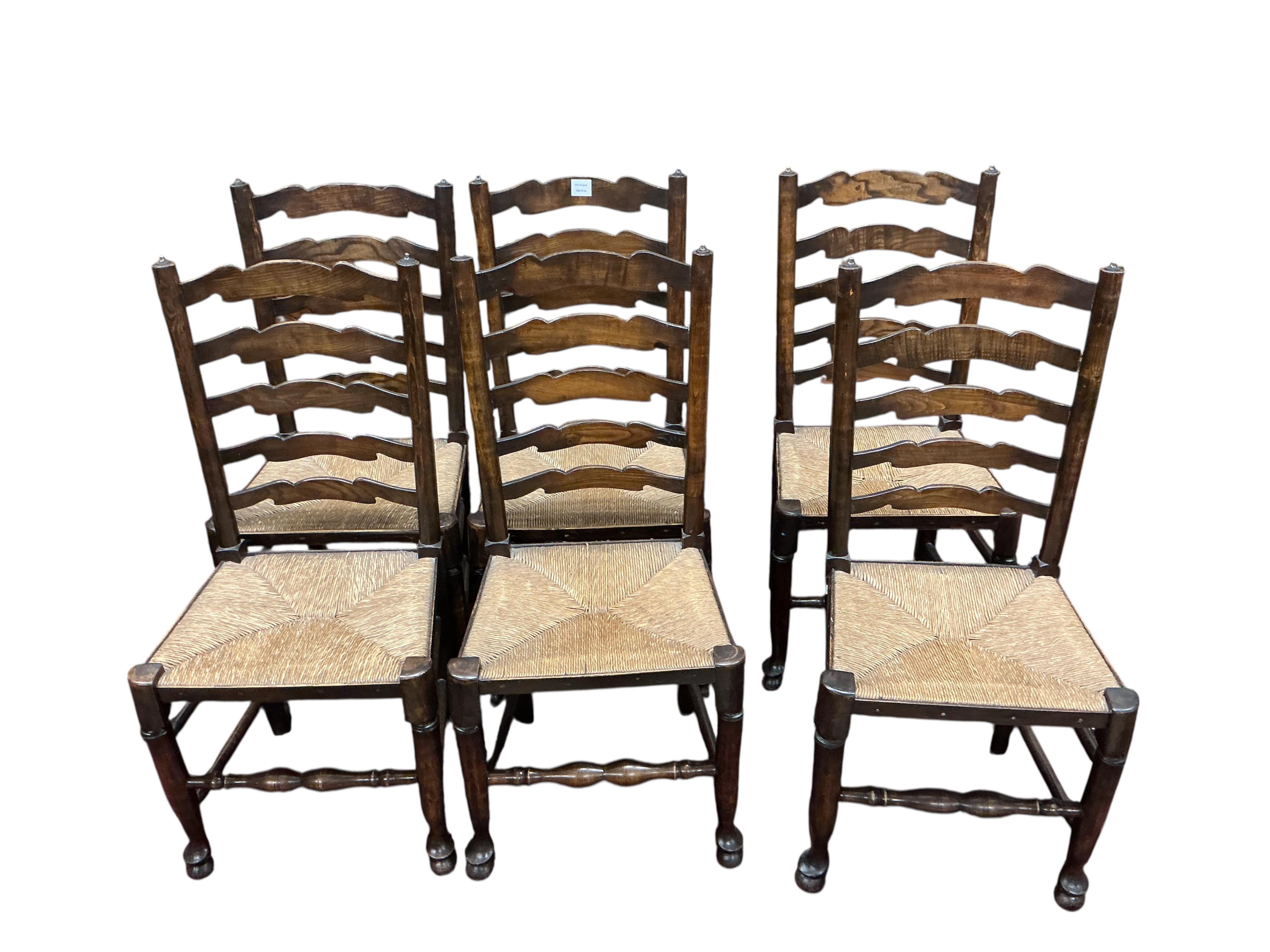 A set of six Lancashire style elm and beech rush seat ladder back dining chairs, width 41cm, height 100cm